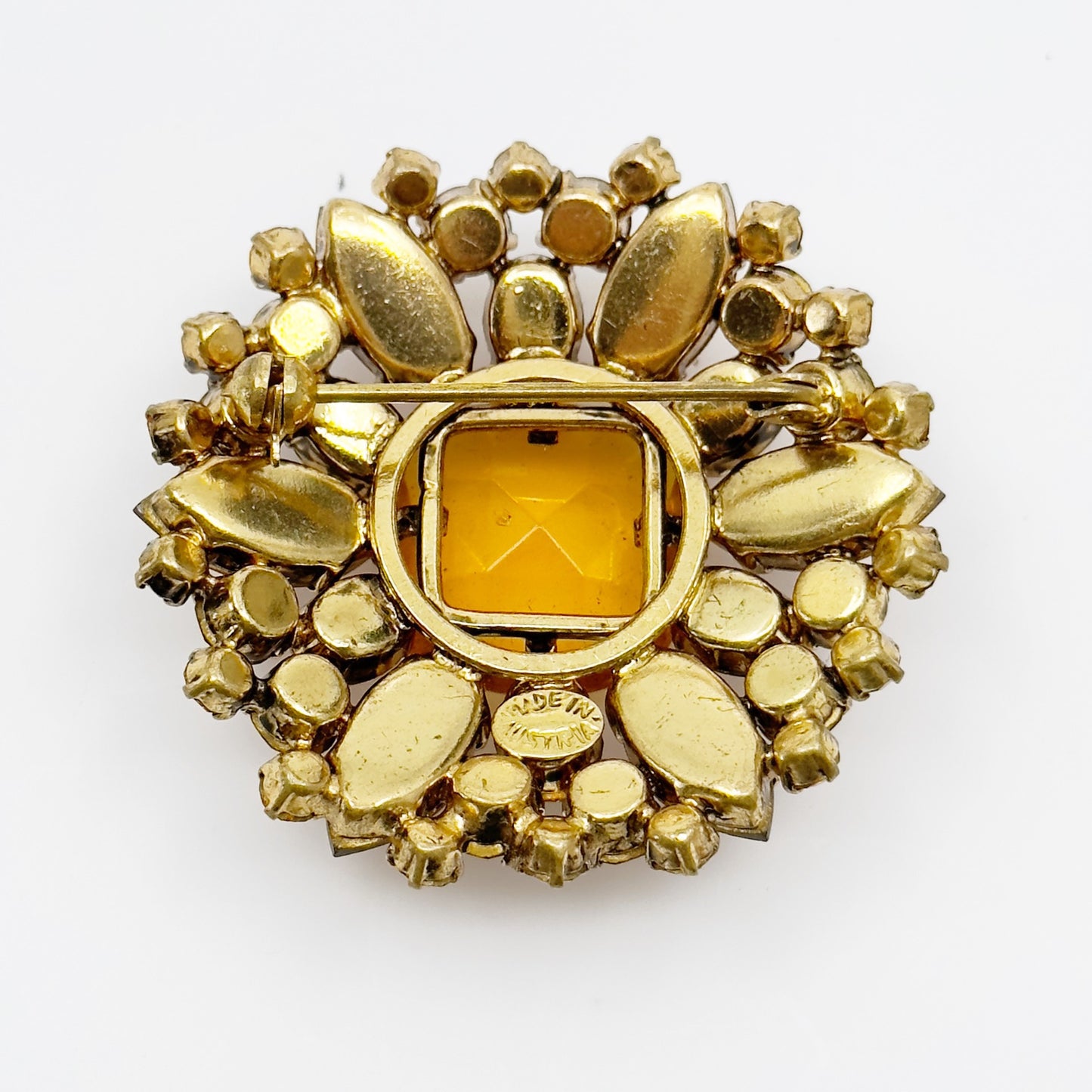 Vintage Made In Austria gold tone amber crystal brooch