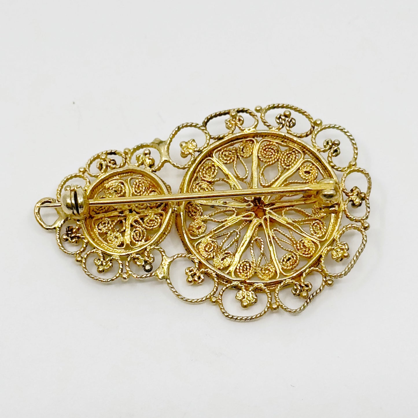 Gold over sterling silver filigree brooch