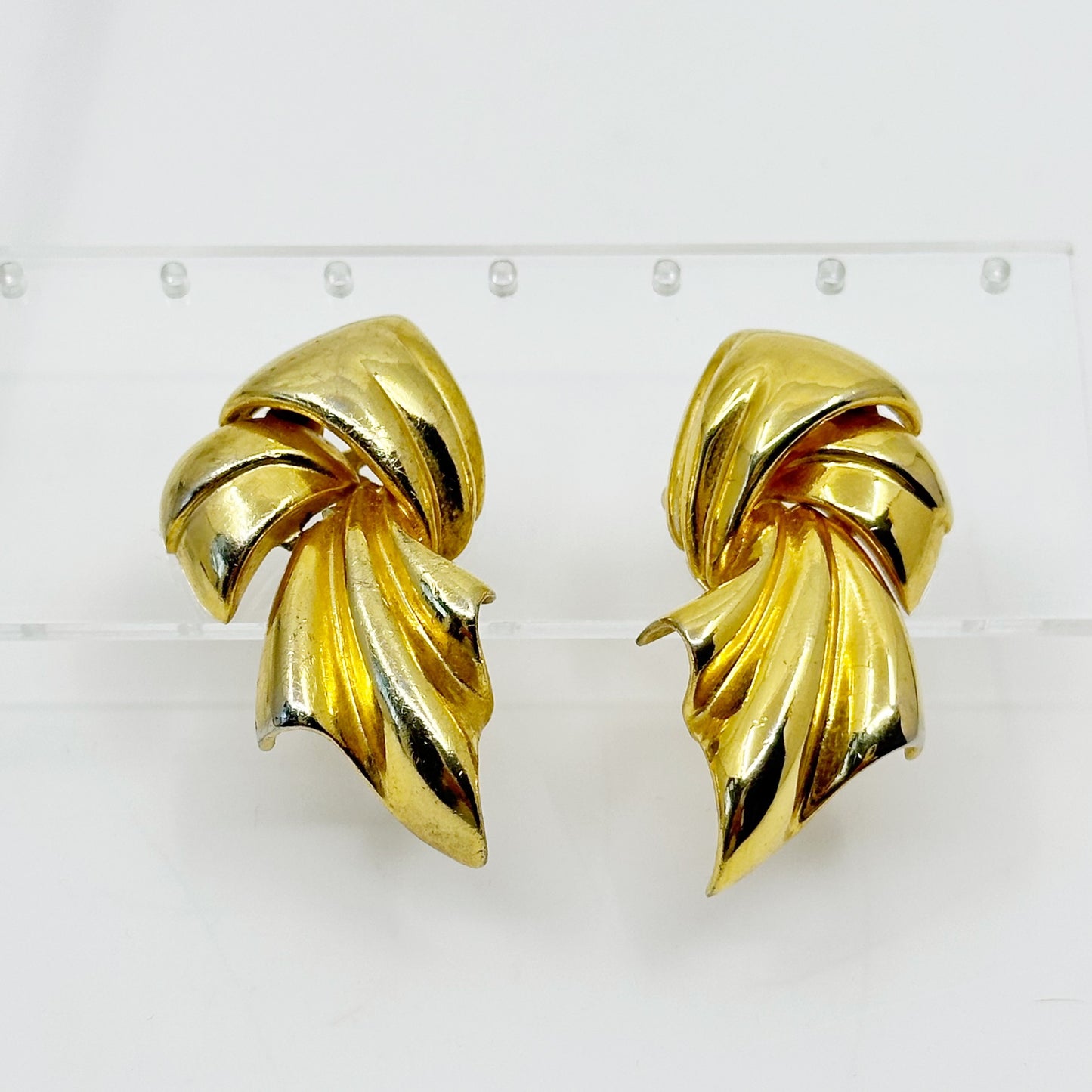 Piscitelli Gold tone Draped Knotted Scarf clip on Earrings