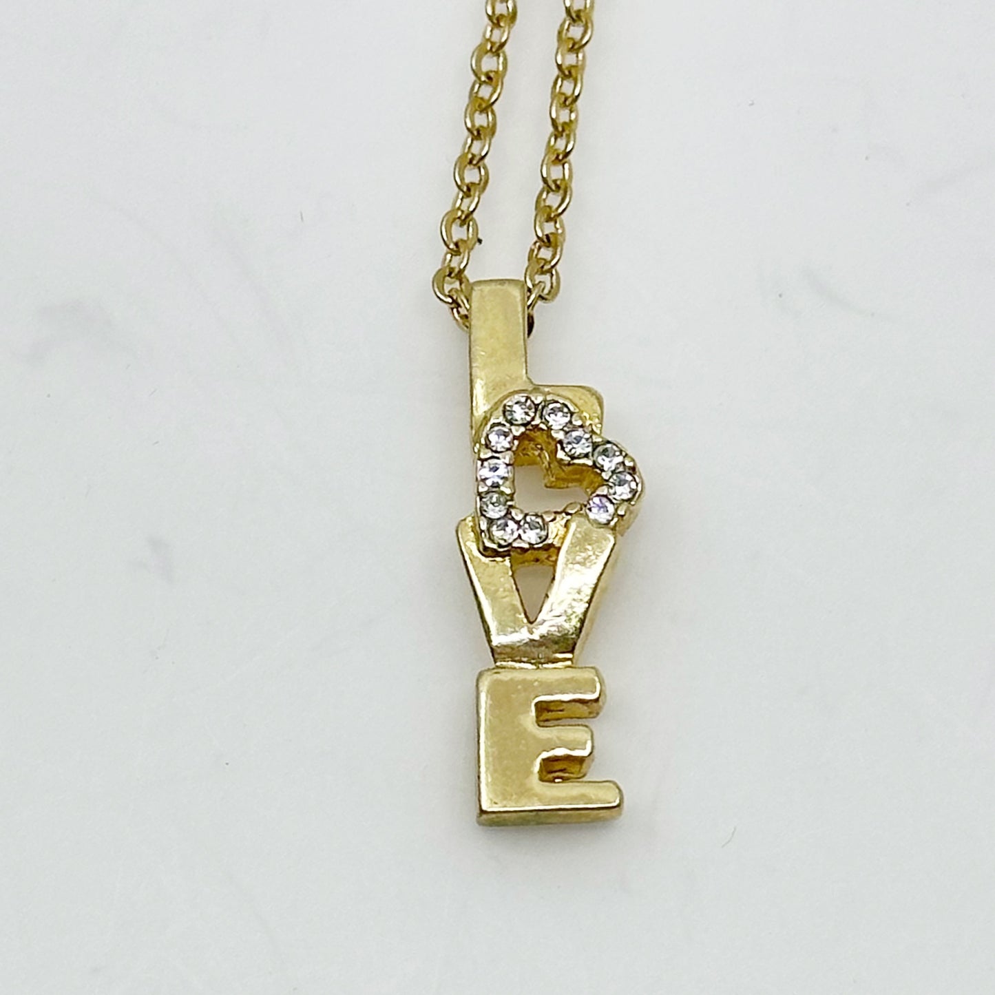 Gold tone rhinestone Love pendant necklace