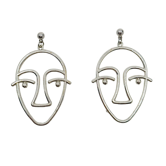 Silver tone face earrings