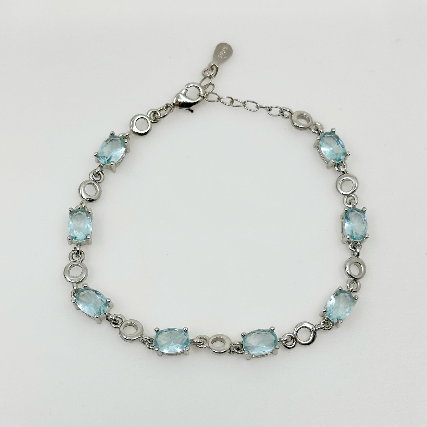 Silver Tone blue topaz tennis bracelet