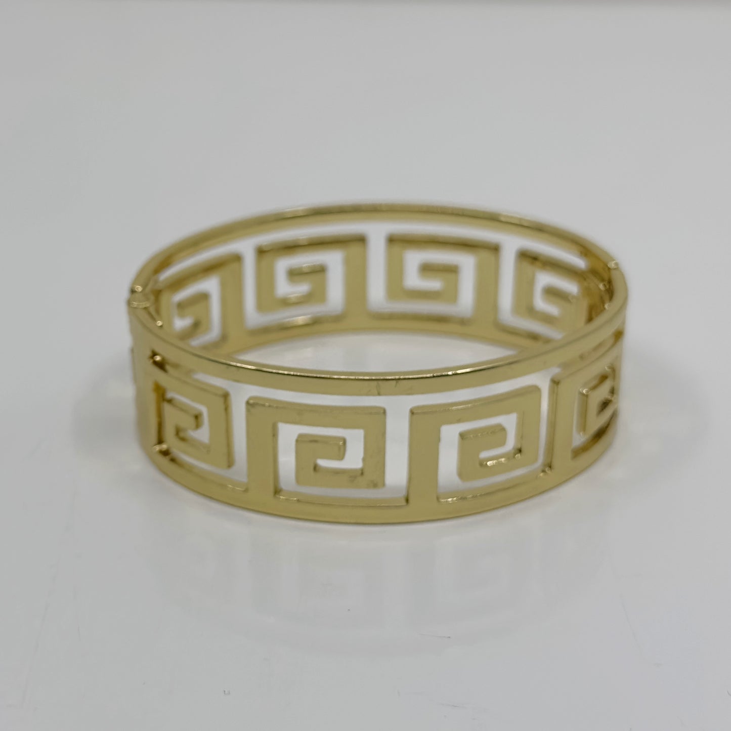 Gold Tone Greek key hinged bangle bracelet