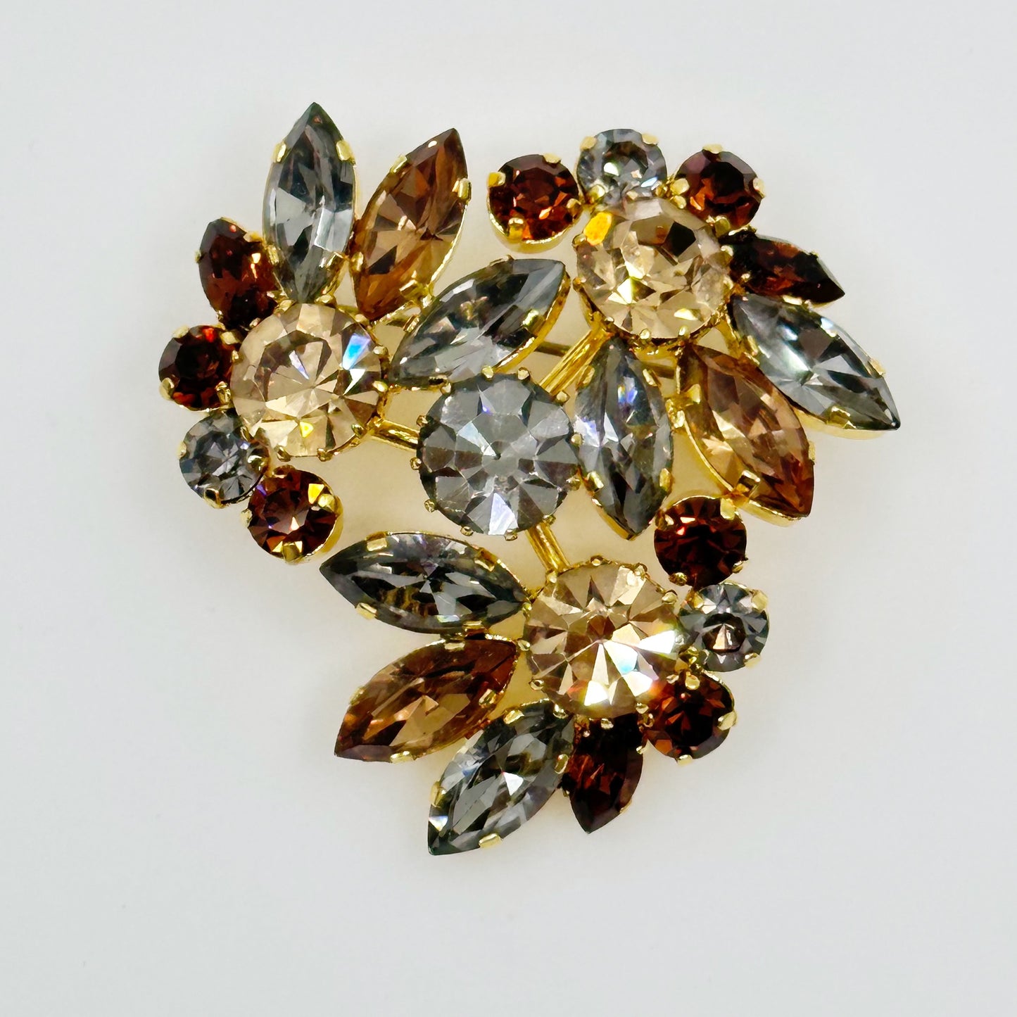 Vintage Austria Gold tone rhinestone brooch