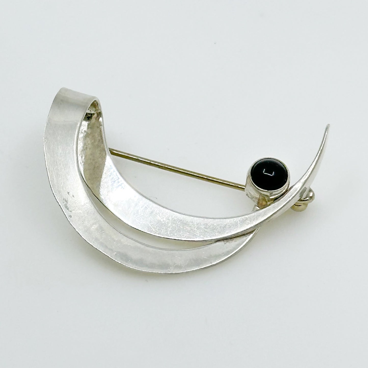 Modernist sterling silver onyx brooch