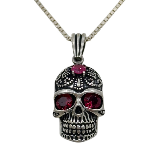 Sterling silver ruby skull pendant