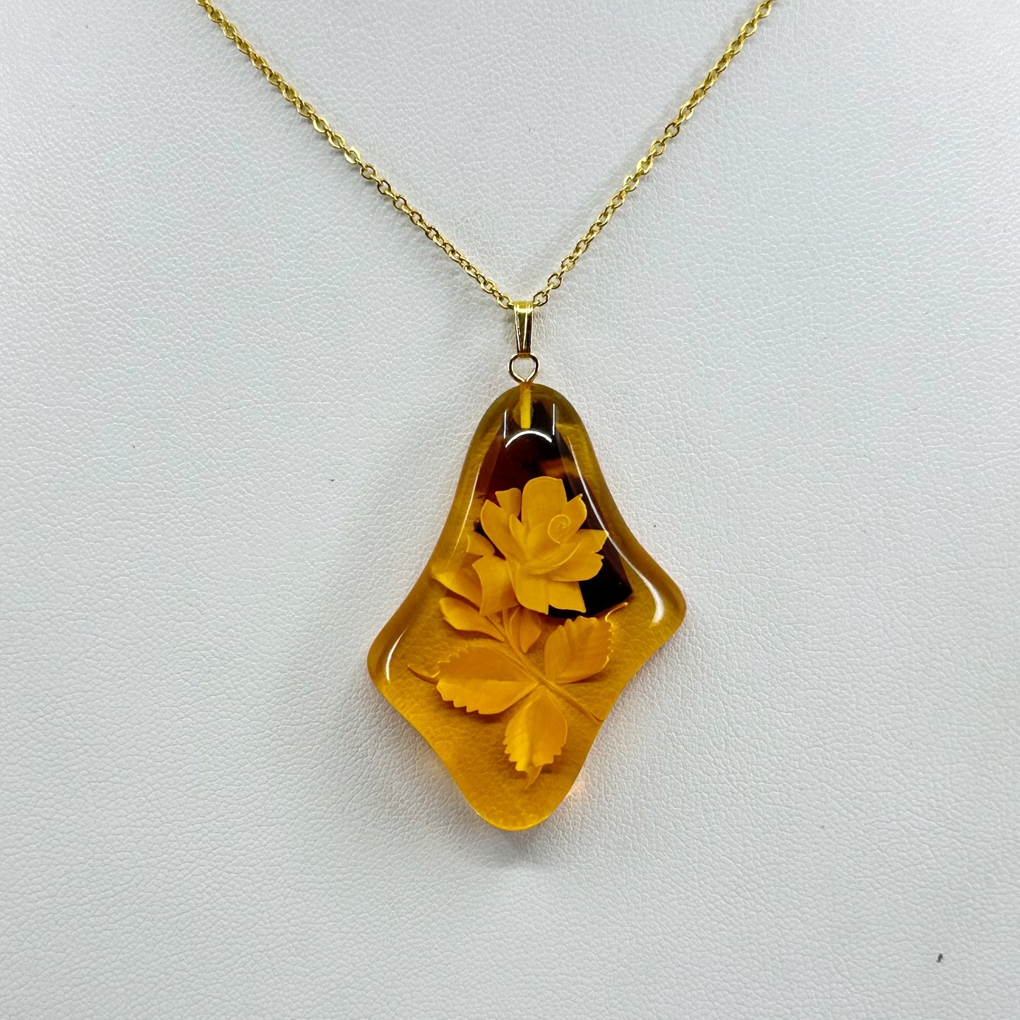 gold plated reverse carved rose baltic amber pendant necklace